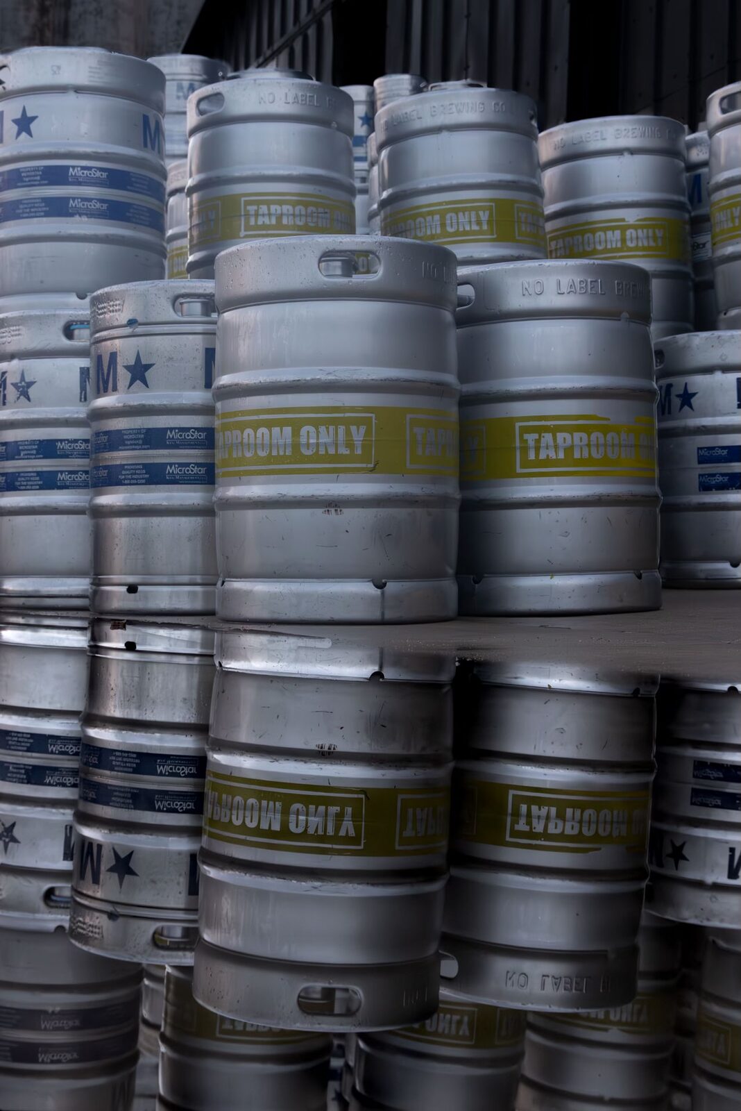 Stacks of No Label Brewing kegs